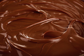 Background of melted milk chocolate, close-up