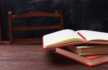 Books and school accessories on wooden table