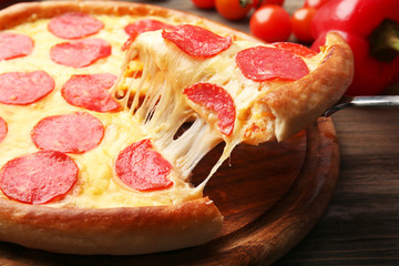 Hot tasty pizza with salami, close up