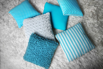 Decorative pillows on grey background