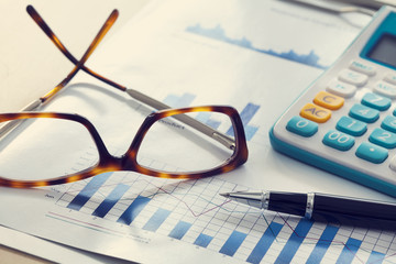 Business chart and eyeglasses