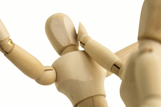 wooden figure abuse hitting concept