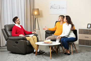 Young happy couple after therapy session with family psychologist