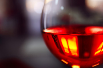 Glass of wine on blurred background