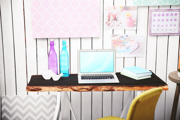 Modern workplace for designer on brick wall background