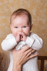 Funny Baby portrait  with fingers in the mouth
