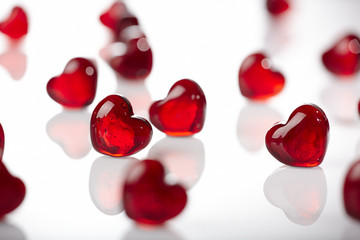 Red glass hearts on white