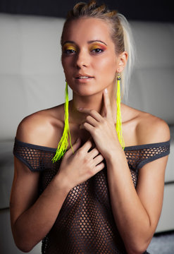 Beauty fashionable sexy woman portrait in the living-room