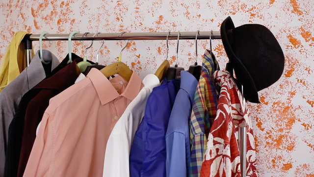 Clothes stand picking shirts