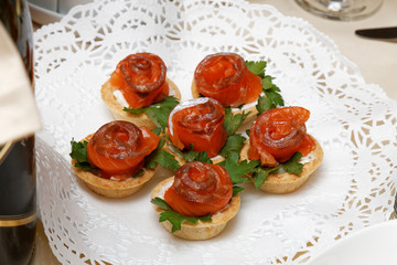Tartlets with red fish and parsley leaves