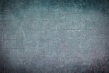 Obraz na płótnie Canvas old blue brickwall with dark vignette borders