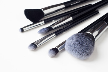 Selection of make-up brushes isolated on white.