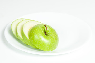 Slices of green apple in a  plate