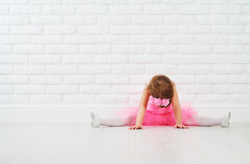 Fototapeta premium little girl dancer ballet ballerina stretching