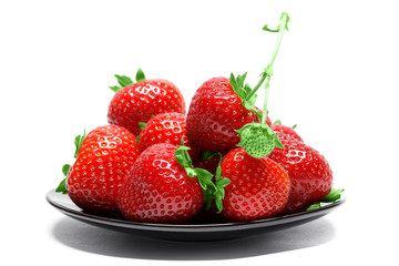Strawberries on plate isolated on white background