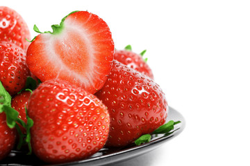 Strawberries on plate isolated on white background