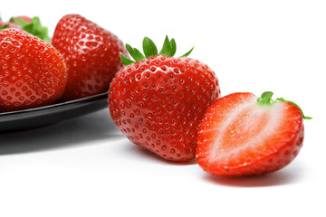Strawberries on plate isolated on white background