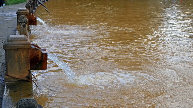 Water tap in Terra Nostra thermal pool at Furnas, Sao Miguel island on Azores, Portugal
