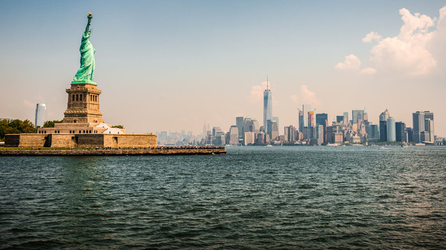 Statue of Liberty and New York skyline on the background