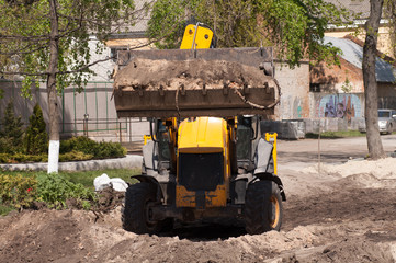 excavator works with the earth closeup