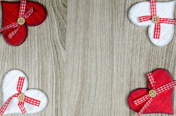 Wooden background with red and white hearts.