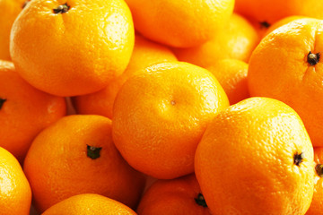 Orange and ripe mandarins background, close up