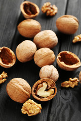 Walnuts on a black wooden table