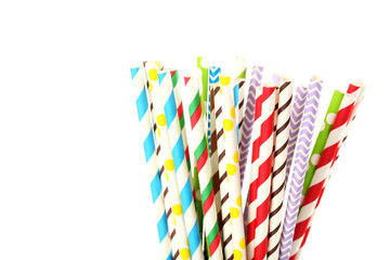 Striped drink straws on a white background