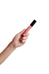 Female hand with lip gloss isolated on white