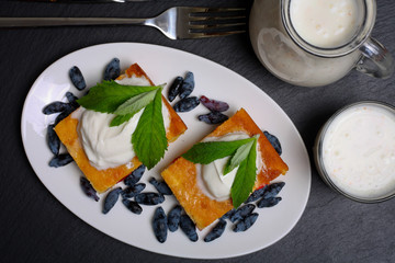 Appetizing cottage cheese casserole with berries and sour cream