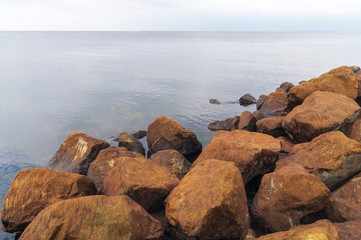 Dutch dike by the North Sea made of concrete stones, Netherlands