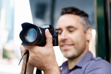 Male photographer taking picture