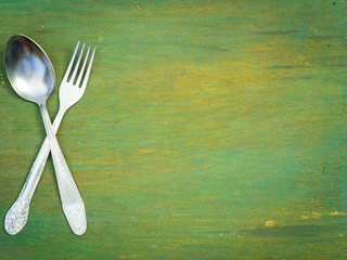 Fork and spoon on old wood