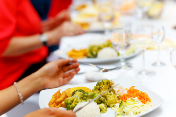 Table setting for an wedding reception. White background.