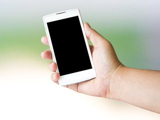 Human hand holding blank mobile smart phone