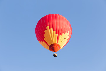 Hot air balloon on blue sky background