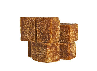Cane sugar cubes on white background