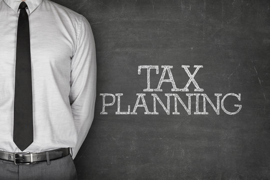 Tax planning text on blackboard 