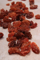 Brown raisins on structure of concrete, healthy eating