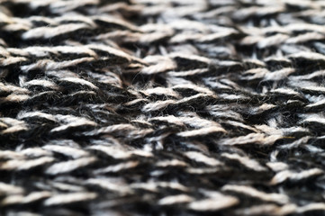 Black and white texture of a knitted textile
