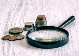  coins and magnifying glass