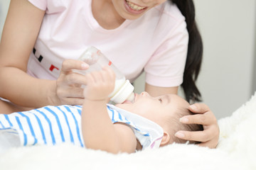 Baby and Mom : Moments of happiness between mother and child.