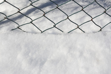 fence and snow,close-up