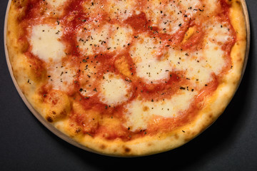 Pizza Margherita with mozzarella cheese and tomato sauce served