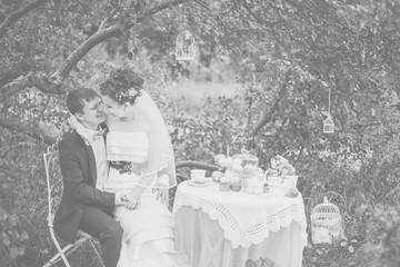 love, dating, people and holidays concept - wedding couple drinking champagne on picnic outdoors