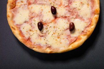 Pizza Vesuvio with mozzarela, tomato sauce, ham, olives... serve