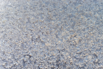 Ice floral pattern on glass. Macro view. Holiday seasonal background.
