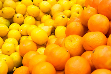 Pile of fresh oranges and lemons