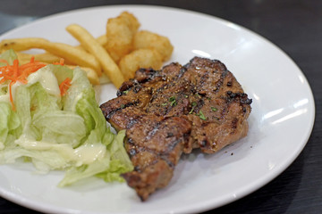 grilled pork steak with french fries