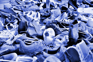 Shoes, lots of used in pile